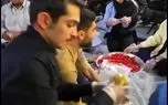 ارسلان قاسمی و پخش ساندویچ در مراسم عید غدیر